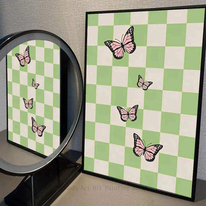 Framed artwork with pink butterflies on a green and white checkered background