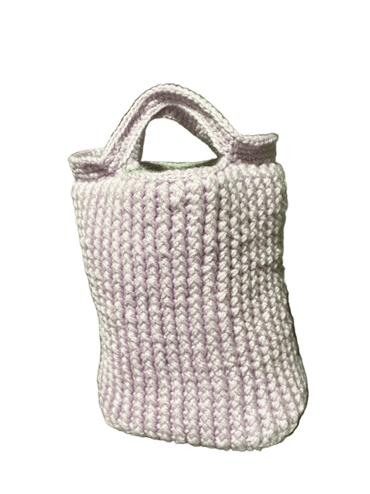Handmade crochet mini tote bag in lilac wool, front view on white background