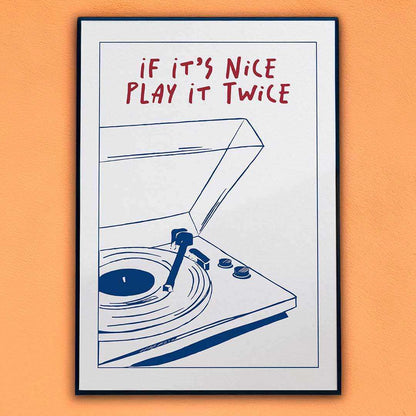 Framed poster with a record player illustration and text 'If it's nice play it twice' on an orange background
