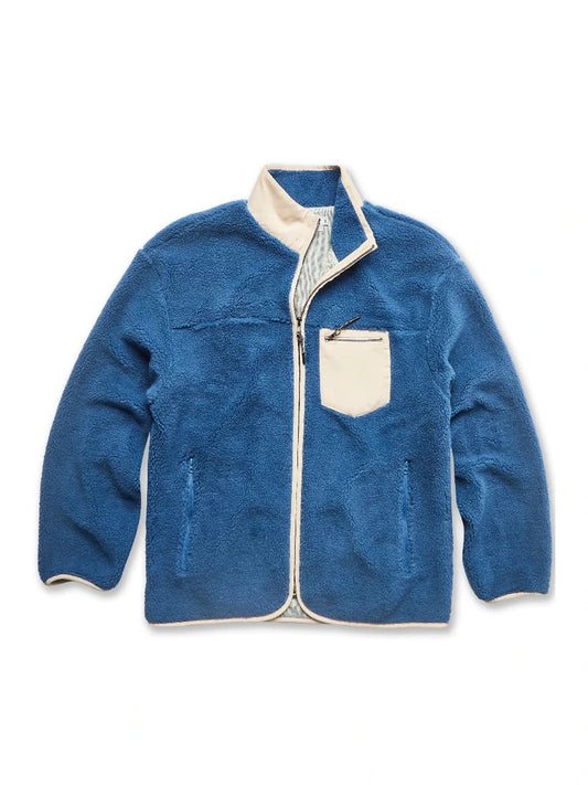 Blue fleece jacket with white trim on a white background