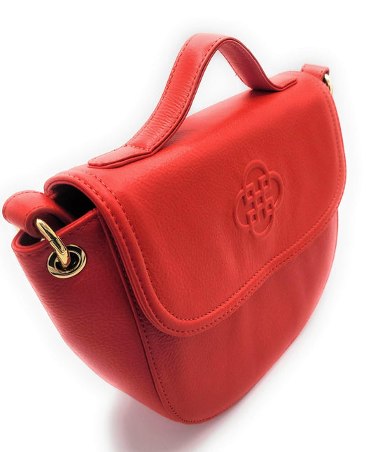 Red handbag with a gold clasp on a white background