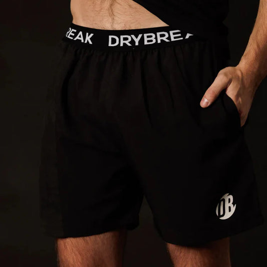 Black athletic shorts with 'DRYBRE' branding on a dark background