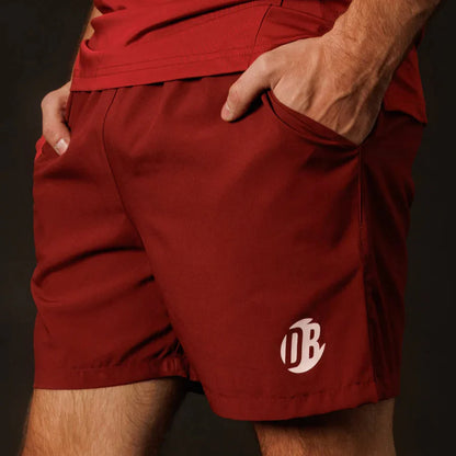 Red shorts with a logo on a dark background