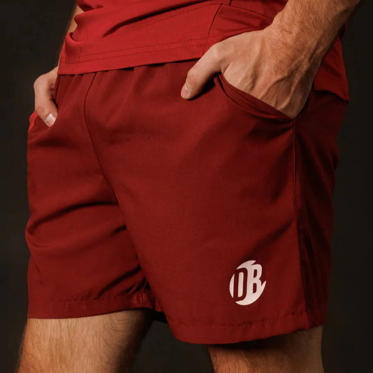 Red shorts with a logo on a dark background
