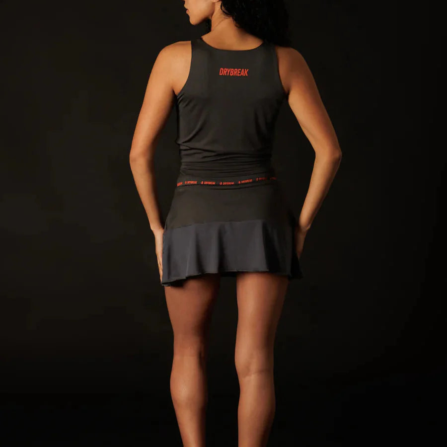 Person wearing a black athletic outfit with 'Drybreak' branding on a dark background