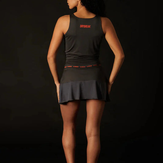 Person wearing a black athletic outfit with 'Drybreak' branding on a dark background