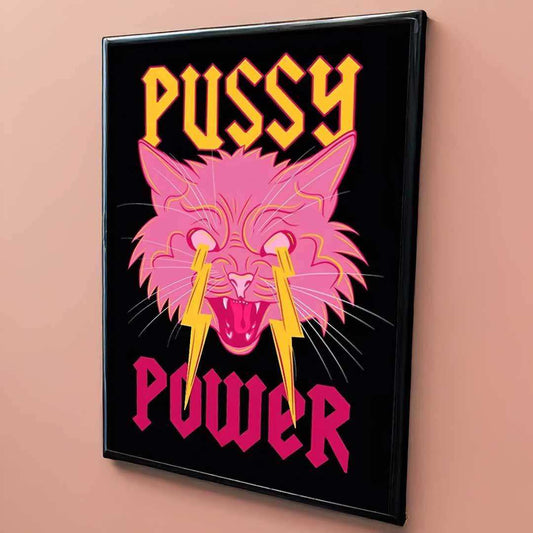 Framed artwork with a pink cat illustration and 'PUSSY POWER' text on a black background.