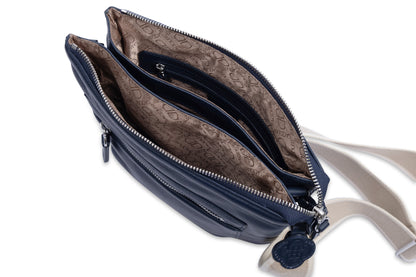 Blue handbag with a beige interior on a white background