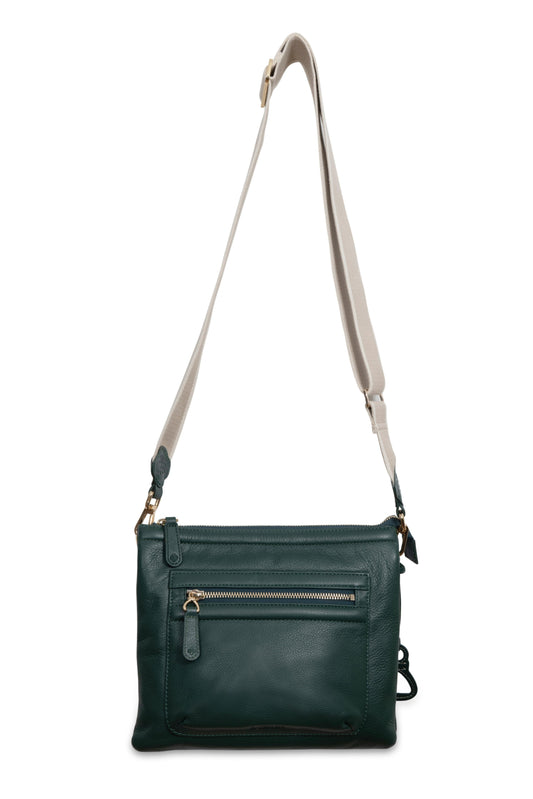 Green leather crossbody bag with a beige strap on a white background