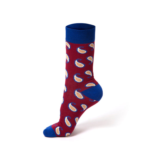 Red sock with blue cuffs and toes featuring a pattern on a white background