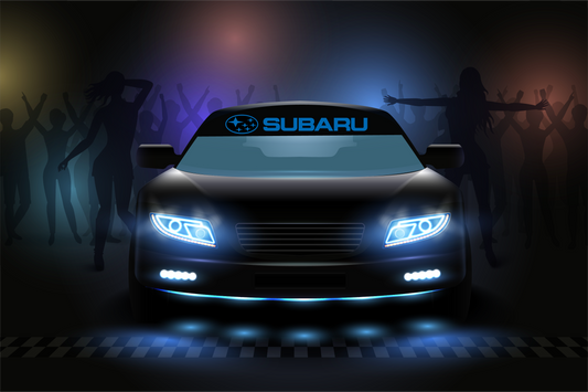 Subaru car with glowing headlights on a dark background