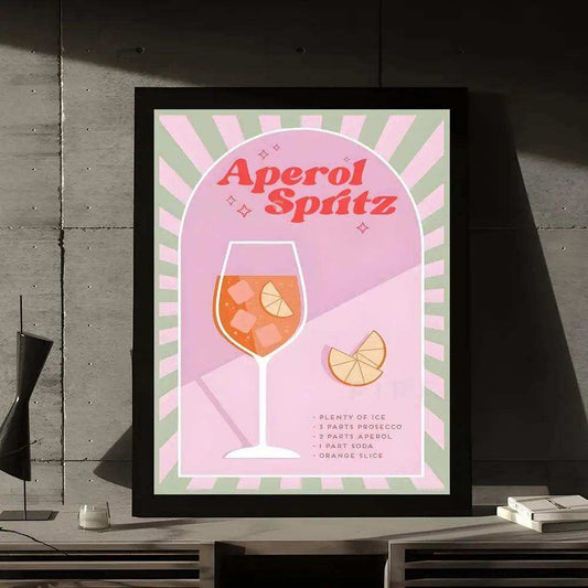 Framed Aperol Spritz recipe poster on a wooden surface with a concrete wall background