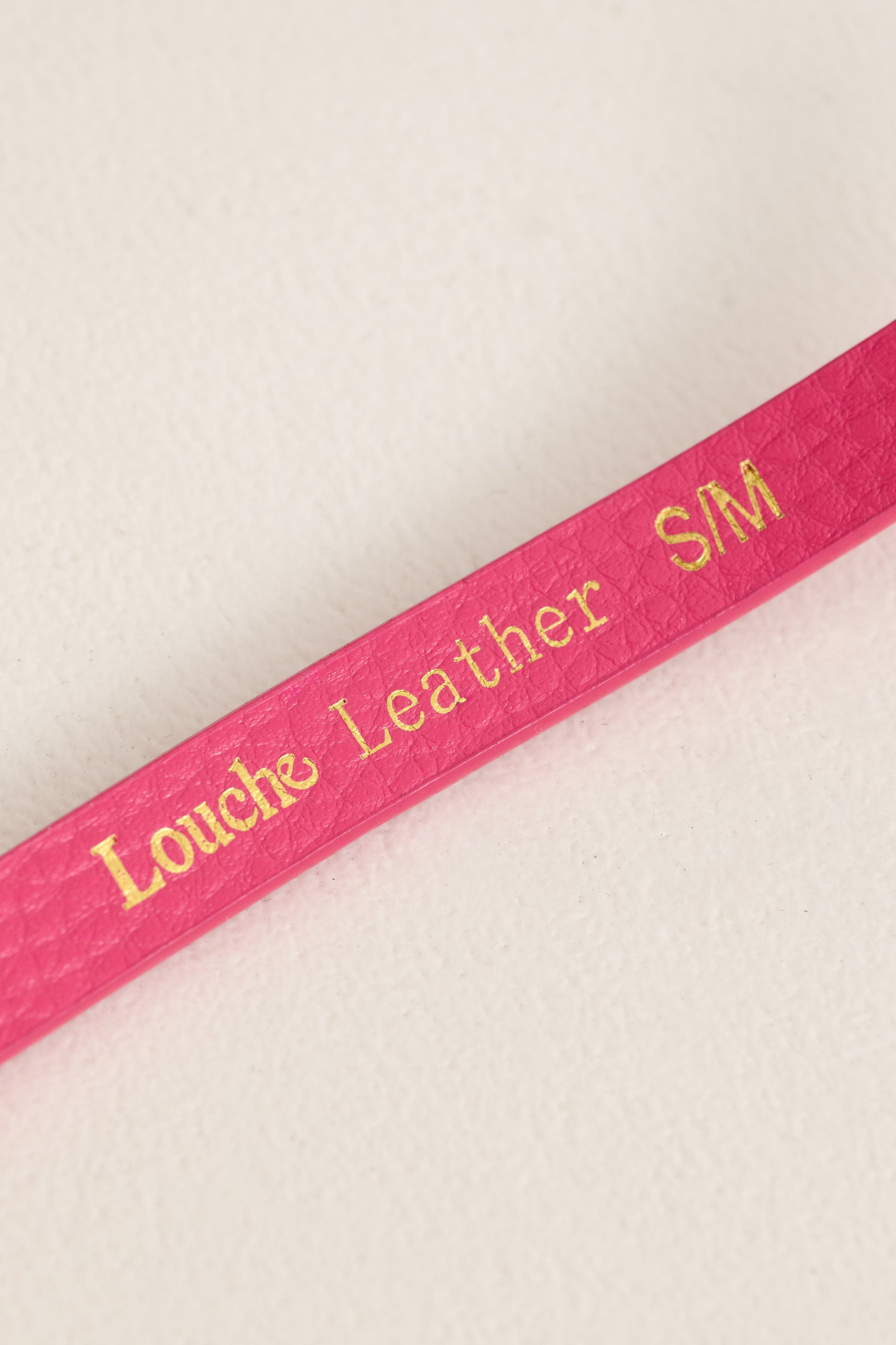 close up The Louche Amira Sleek Belt in Pink