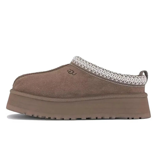 Brown slip-on shoe with textured white trim on a white background