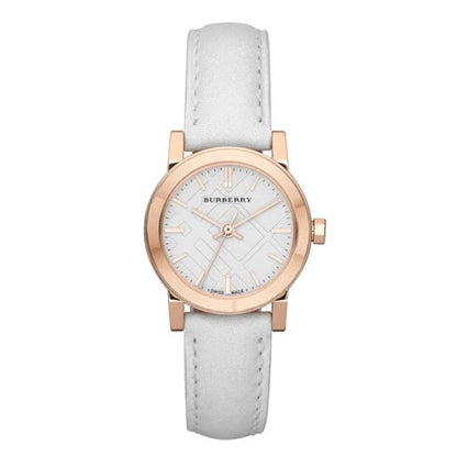 Burberry watch with white strap and rose gold case on a white background
