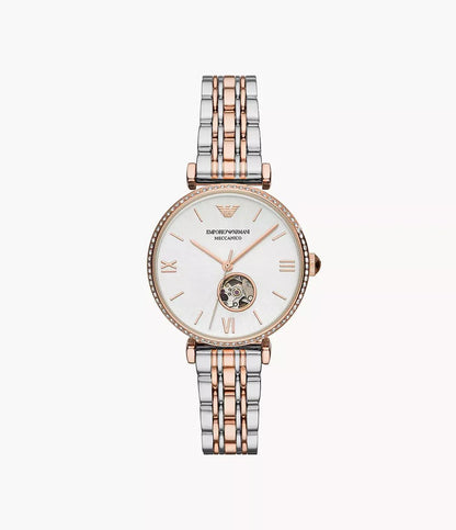 Two-tone watch with silver and rose gold straps on a white background