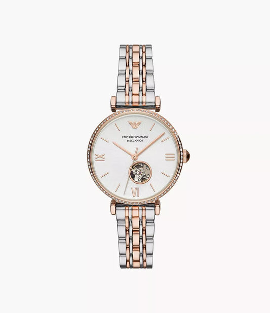 Two-tone watch with silver and rose gold straps on a white background